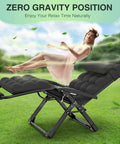 Woman relaxing in Oversized Zero Gravity Lounge Chair 29 Inch XL with cushion and headrest in a garden setting
