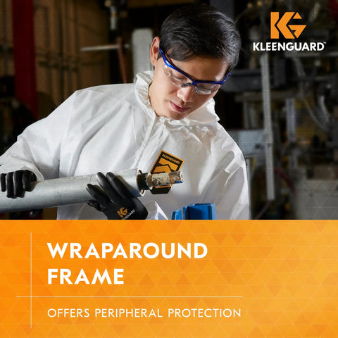 Antifog Safety Glasses Built For The Daily Grind Full Case Bulk Pack With Crystal Clear Lenses And Flexible Metallic Blue Frames For Rock Solid Job Site Reliability worn by worker inspecting metal pipe.