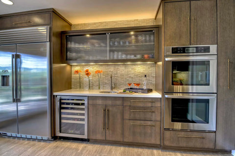 Modern kitchen with brown cabinets and stainless steel appliances, showcasing installed Antique Brass T Bar Cabinet Pulls Set Of 6 Knurled Zinc Alloy Handles With 12.6 Inch Center To Center Spacing, Durable Rust Resistant Hardware For Cabinets, Drawers And Wardrobes Premium Quality.