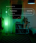 A19 Smart LED Light Bulb With 1100 Lumens, Billions Of Colors And Tunable White illuminating a room in green light at night