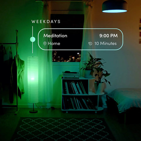 A19 Smart LED Light Bulb With 1100 Lumens, Billions Of Colors And Tunable White illuminating a room in green light at night