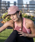 Woman wearing Superlite Hat For Women Lightweight Moisture Wicking Cap For Gym Ready Workouts And Training With UPF 50 Sun Protection