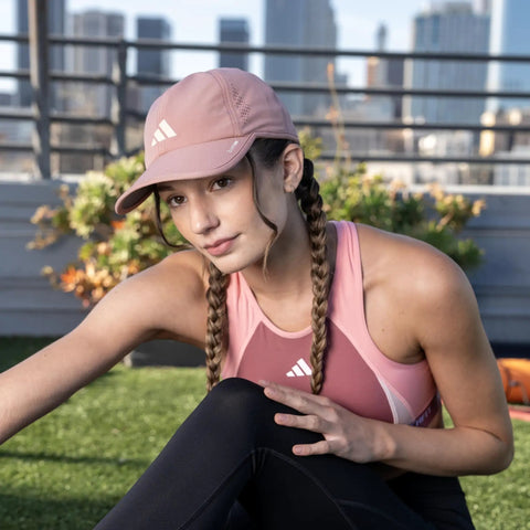 Woman wearing Superlite Hat For Women Lightweight Moisture Wicking Cap For Gym Ready Workouts And Training With UPF 50 Sun Protection