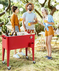 People enjoying drinks by an 80 Quart Rolling Cooler Cart With Lockable Wheels Bottle Opener Cap Catcher For Outdoor Parties
