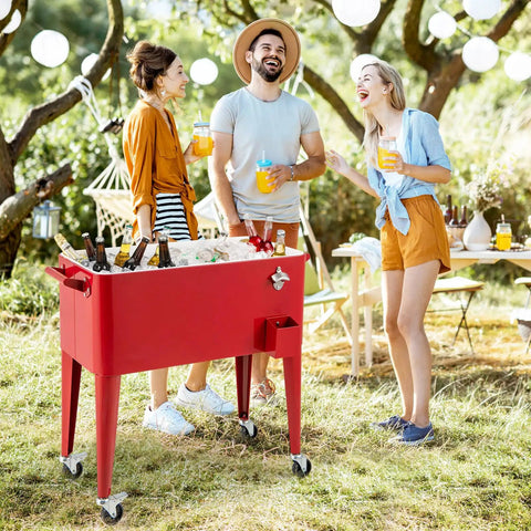 People enjoying drinks by an 80 Quart Rolling Cooler Cart With Lockable Wheels Bottle Opener Cap Catcher For Outdoor Parties