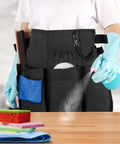 Person wearing Pro Grade Cleaning Apron With 9 Pockets And Adjustable Waist Belt For House And Hotel Jobs Durable Black Caddy Apron with cleaning tools.