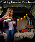 Badass 2000 Watt Pure Sine Wave Power Inverter Converts 12V DC To 110V AC For Rvs Trucks And Homes in use while traveler pours coffee.