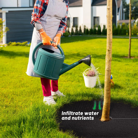 Person watering tree with 32.5 Inch Nonwoven Tree Mulch Ring Six Pack Reusable Weed Barrier Mat Degradable Go To No Fuss Weed Growth Inhibitor And Protect Tree Roots For Easy Landscape Weed Control