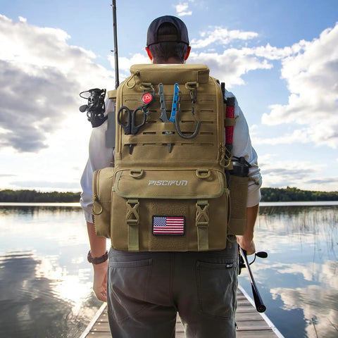 Man standing by lake with 52L Fishing Tackle Backpack With Rod Holders And Four Tackle Boxes, Water Resistant, Khaki