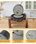 Old School Stone Grain Mill Hand Grinder with disks, stainless steel handle, natural granite stone on wooden countertop