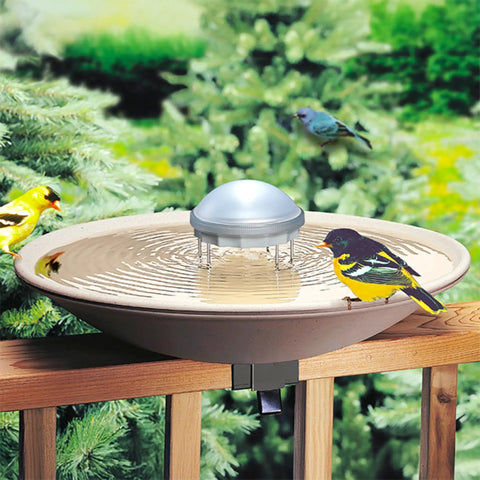 Solar Water Wiggler Bird Bath Scene 8WW 5 Inch gray unit in bird bath, surrounded by trees and birds, moving water in bright sun