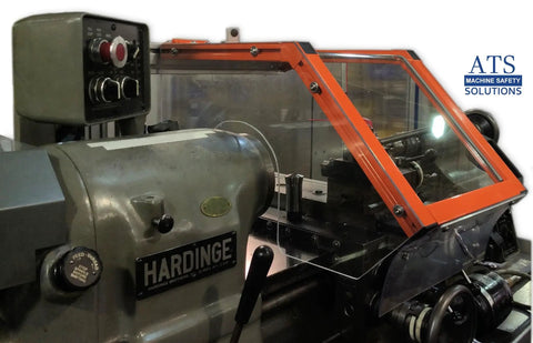 Lathe Chuck Guard For Hardinge HLV And Similar Lathes, 12 Inch Wide Hinged Shield, installed on lathe, orange frame, Lexan window.