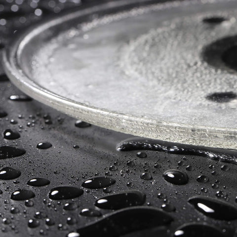 Close-up of 10.5 Inch Microwave Glass Tray Replacement Compatible With 252100500497 HB-P90D23 with water droplets on surface