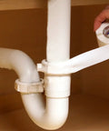 DIY Quick Leak Fix Tape For Under Sink Pipes No Adhesive Self Fusing Silicone Wrap applied on white PVC plumbing