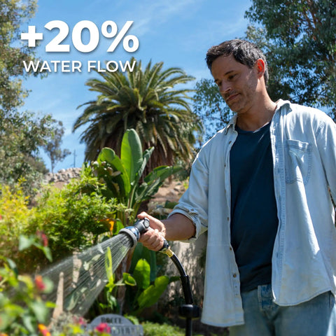 Man using Five Eighth Inch By One Hundred Foot Heavy Duty Retractable Garden Hose Reel With Wall Mount in garden