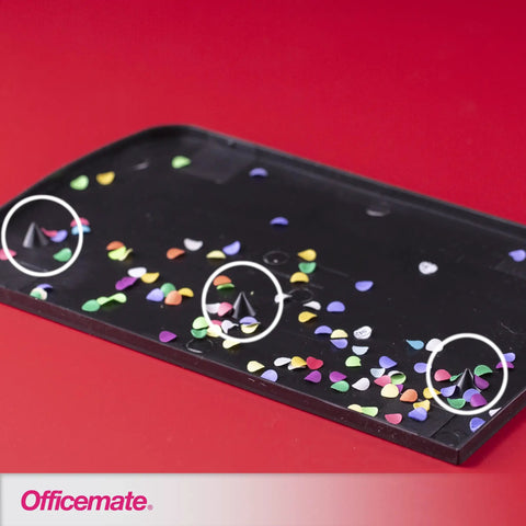 Confetti tray showing colorful paper circles from 3 Hole Punch for Home Office, Medium Duty, 30 Sheet Capacity, Black, Metal Base