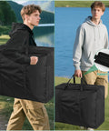 Person carrying Heavy Duty Tent Storage Bag With Padded Handles, Waterproof 600D Oxford, Rugged Pole Organizer, black, in outdoor setting
