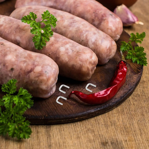 Get The Most Dope Sausage Making Gear With 4000 Heavy Duty Aluminum U Clips For Your Manual Clipper That Hold Tight And Never Bend During Any Crazy Meat Day, with fresh sausages and red chili.