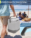 Person carrying Heavy Duty 35 QT Portable Electric Cooler And Warmer For Cars Trucks And Homes 12V 110V Thermoelectric Fridge Box With Power Cord Gray on beach.