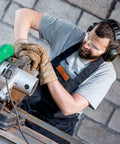 Man wearing Bulk 100 Pack Safety Glasses Eye Protection Eyewear Clear Lenses operating power tool