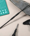 Double Pointed Carbide Scribe Tool Heavy Duty Metal Marking Pen For Welding Glass Ceramics Sheet Metal with smooth grip on a workbench