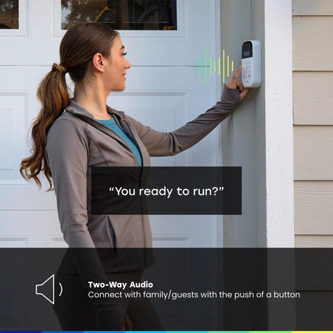 Woman using Smart Garage Door Keypad With Wide Angle Camera And Custom PIN Codes For Smartphone Control Real Time Alerts And Motion Detection For Safer Easier No Fuss Garage Access installed on garage wall.