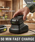 20V Cordless Leaf Blower With 2Ah Battery And Fast Charger in use, close-up of hand placing battery on charger with LED indicator