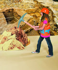 Child in construction costume using a toy pickaxe with a realistic setting, part of Minecraft Inflatable Pickaxe Toys 12 Pack For Birthday Party Supplies Lifesize Gaming Props For Goodie Bags And Gamer Decor Safe Vinyl Weapons For Kids Ages 8 To 12 Realistic Game Scale Party Favors.