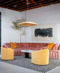 Totally Main Character Energy One Light Pendant Ceiling Light Fifty Two Inches Wide Vintage Gold Leaf Metal Dome Shade Hanging Lamp styled above a modern living room.