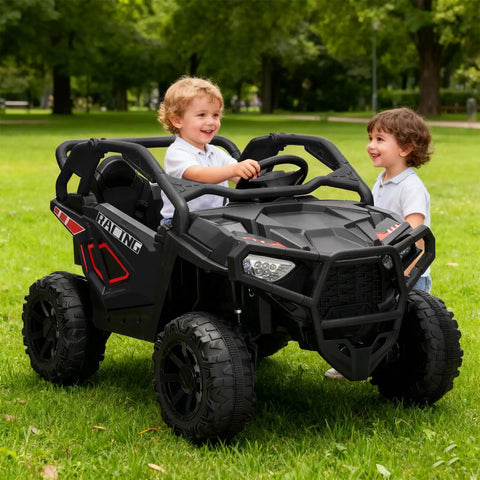 Two children in a black Powerful 24V Two Seater Ride On Car With 800W Motors, Four Wheel Drive, in a park setting