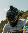 Cyclist with Premium Flat And Curved Surface Action Camera Mounts Featuring Industrial Strength Adhesive on helmet outdoors.