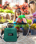 Battery Powered Garden Sprayer 2 Gallon With USB Rechargeable Handle used by woman and child in garden with plants
