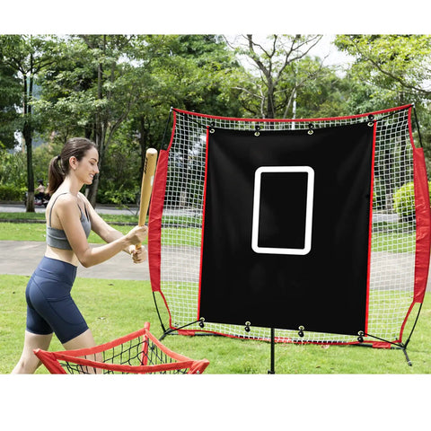 A woman practicing with a Backstop 4Ft By 6Ft Batting Cage Target Backdrop With Strike Zone, featuring weatherproof PVC, in a park.
