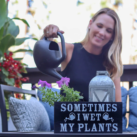 Funny Garden Sign For Outdoor Decor And Plant Lover Gifts displayed near smiling woman watering plants, solid wood garden art, 6x12 in