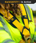 Close-up of Monsoon Safety Harness with four heavy duty D rings on a person wearing high-visibility work gear.