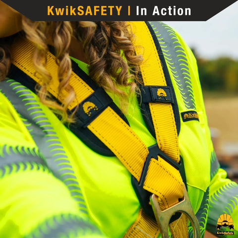 Close-up of Monsoon Safety Harness with four heavy duty D rings on a person wearing high-visibility work gear.