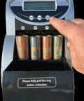 Automatic Coin Counter And Sorter With Digital Display For Loose Change Processing features user adjusting settings on the control panel.