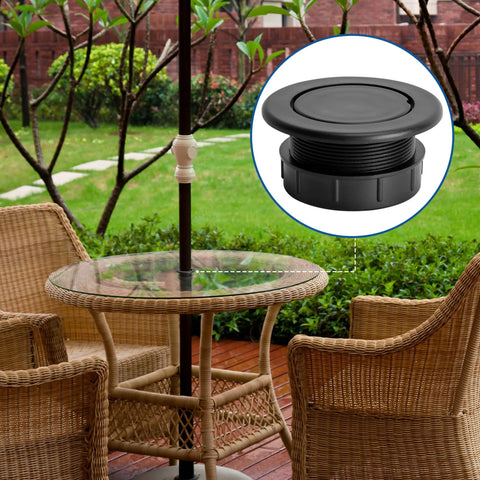Outdoor patio table with Two Pack 2 Inch Parasol Umbrella Hole Ring Plug And Cap Set, black ABS, in garden setting.