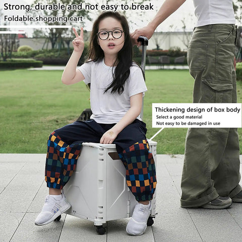 Child sitting on collapsible rolling crate on wheels for teachers with heavy duty plastic tote basket in outdoor setting.