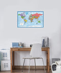 Durable Laminated World Map And US Map Poster Set 18 By 29 Inches Wall Chart Maps Of The World And United States Made In The USA Tear Resistant 3 Mil Lamination Must-Have For Classrooms Home Office Or Study Space displayed in an office setting above a desk.