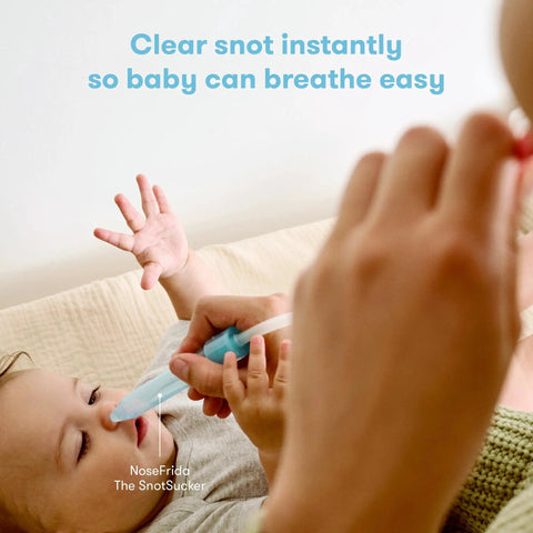 Using NoseFrida Snotsucker on baby from All In One Baby Health Care On The Go Travel Kit With NoseFrida Snotsucker Rectal Thermometer MediFrida Medicine Dispenser And Portable Carrying Case Ideal Gift Set For Parents