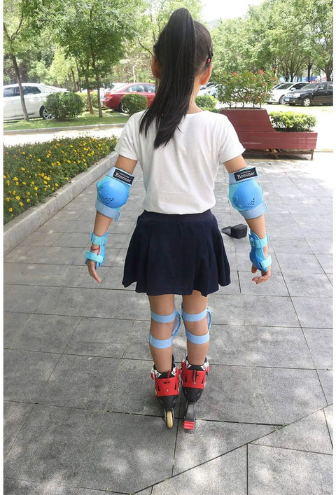 Child in Kids Protective Gear Set Knee Pads Elbow Pads And Wrist Guards For Ages 3 To 15 Roller Skating outdoors