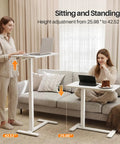 Total Game Changer Over Bed Table With Smooth Rolling Casters And No Sweat Pneumatic Height Adjustment Super Spacious Work Surface for sitting and standing.