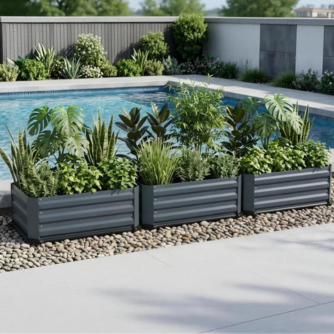 Three grey Two Pack Galvanized Raised Garden Beds With Bottom Indoor And Outdoor Use Rust Proof Metal Planter Box by a pool with plants.