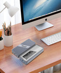 Sleek Plug And Play M.2 NVMe SSD Enclosure With Smart Cooling Fan And Transparent Back Plate For Thunderbolt 3 4 USB4 Macbook PC Ipad Setup Supporting Up To 8TB on a wooden desk with a monitor and keyboard.