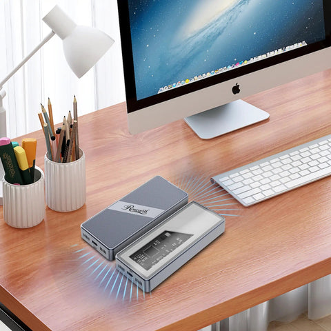 Sleek Plug And Play M.2 NVMe SSD Enclosure With Smart Cooling Fan And Transparent Back Plate For Thunderbolt 3 4 USB4 Macbook PC Ipad Setup Supporting Up To 8TB on a wooden desk with a monitor and keyboard.