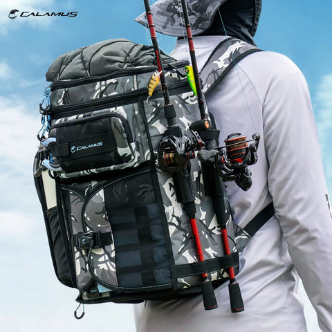 Angler wearing GearMaster Tackle Backpack With Bait Binder For Fishing Gear, camo design, rod holders visible.