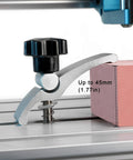 2 Pack Mini T Track Hold Down Clamps for CNC Routers installed on a 3018 Series machine, holding a pink block, close-up view