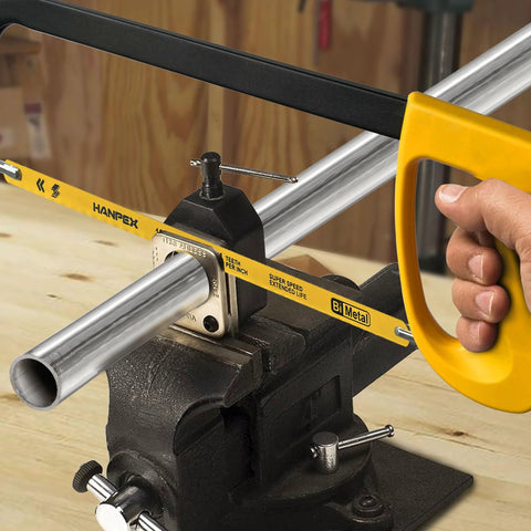 Hanpex 12in high-tension hacksaw frame with 24 TPI bi-metal blade, yellow handle, mounted in a bench vise.