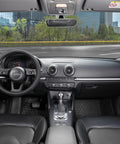 Interior view of a car showcasing a black microfiber steering wheel cover for comfort and grip.